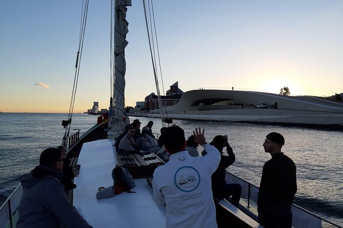 2-Hour Lisbon Traditional Boats Sunset Cruise with White Wine - Sunset, music, and free-flowing wine