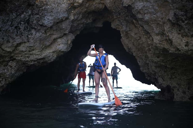 Albufeira: Caves and cliffs Paddleboarding (SUP) Tour - Finding the kiosk at Praia da Coelha
