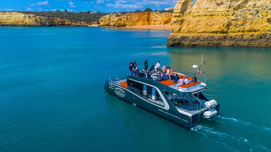 Albufeira: Coastline and Benagil Caves Tour by Catamaran - The swim stop comes on the way back