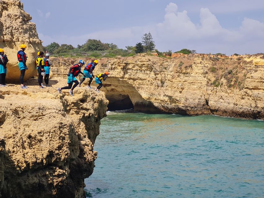Albufeira: Guided Coasteering Tour with Cliff Jumping - Swimming through caves near Albufeira