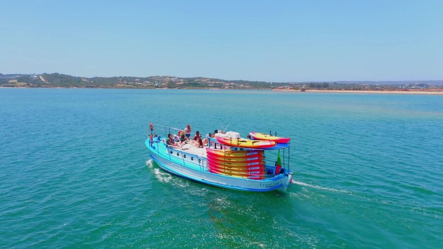 Alvor: Explore Caves Boat and Kayak Tour - Swimming from the boat in clear water