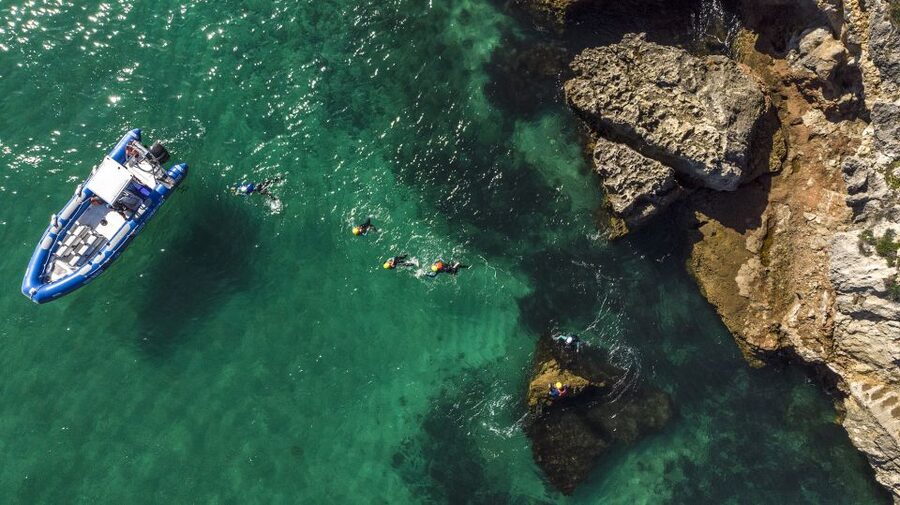 Arrábida: Setubal, Sesimbra Coasteering & Speedboat Tour - Swimming through caves and along the bays