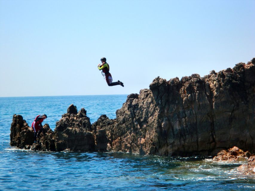 Coasteering Algarve: Cliff Jump, Swim & Climb in Sagres - Swimming through turquoise water and sea caves