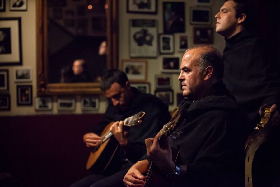 Coimbra: Live Fado Show with Glass of Port Wine - Singers, guitars, and the changing mood of the show