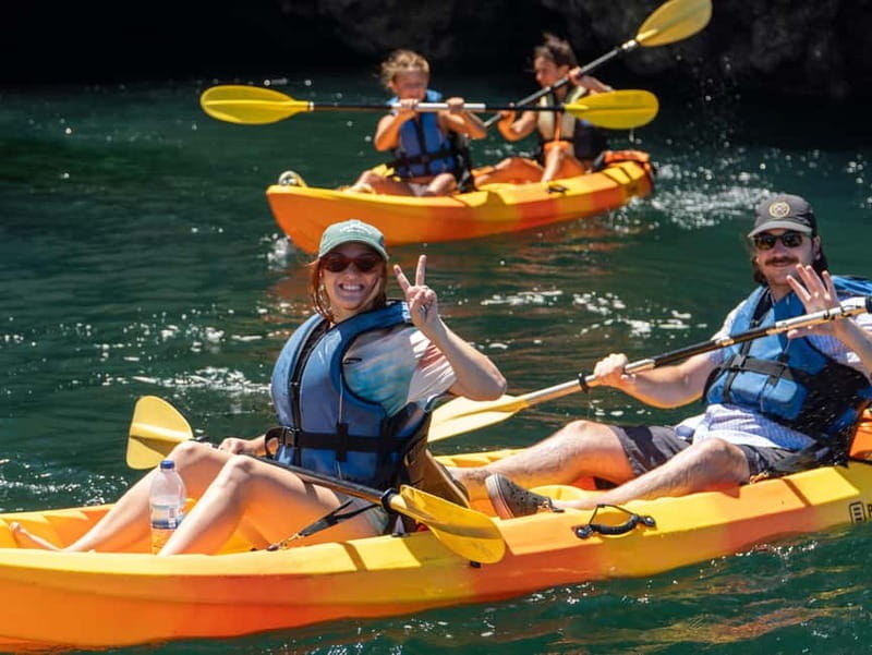 From Lagos: Ponta da Piedade Caves Kayak Tour from Catamaran - Sliding into a kayak at Ponta da Piedade