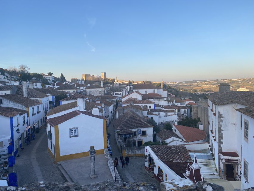 From Lisbon: Fátima, Batalha, Nazaré, and Obidos Tour by Van - Óbidos: cobbles, walls, and a chocolate cup