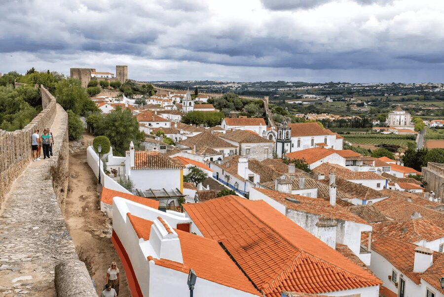 From Lisbon: Nazare Big Waves and Óbidos Guide Day Trip - Climbing to the Sítio and Nazaré Lighthouse