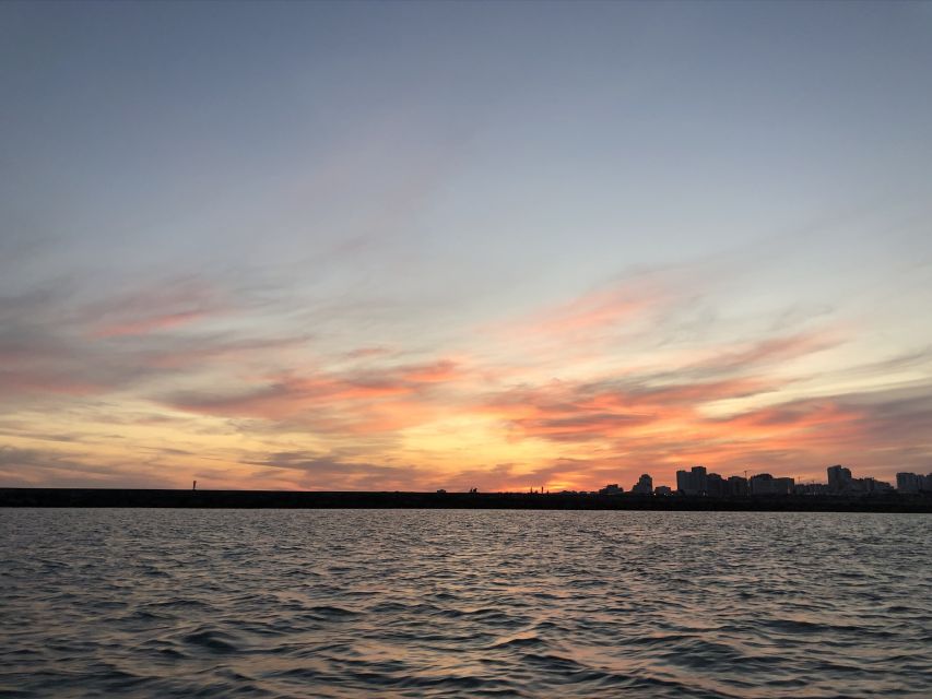 From Portimão: Sunset Boat Trip with Wine - Sailing toward Alvor along the Algarve coast