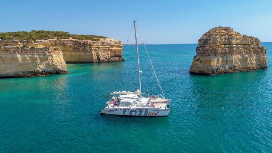 From Vilamoura: Sunset Catamaran Experience - Following the Algarve coast toward the caves