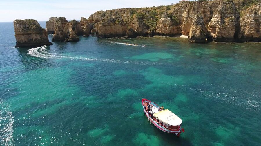 Lagos: Ponta da Piedade Cave and Coastal Tour - Entering the Ponta da Piedade grottoes by small boat