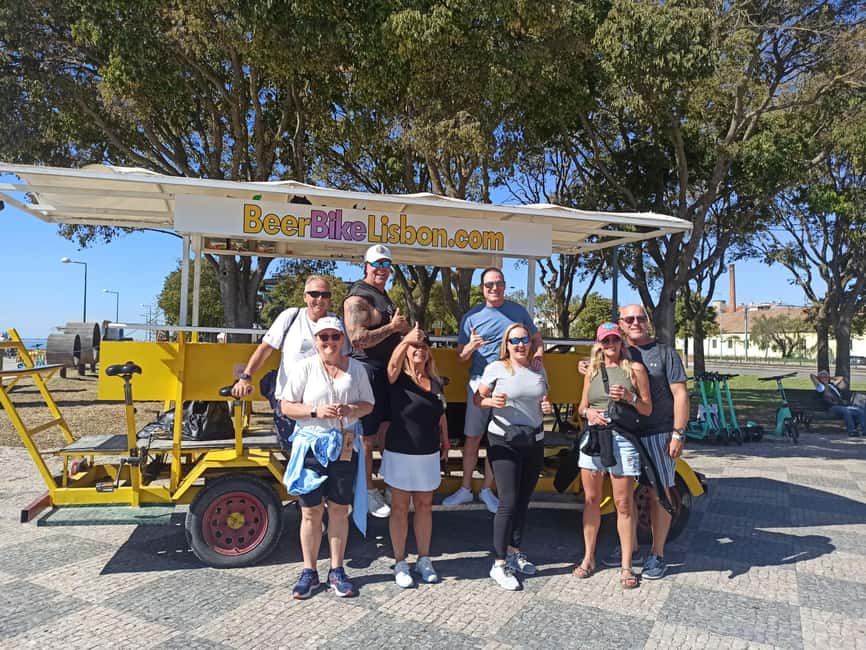 Lisbon: 1-Hour Beer or Sangria Bike Sightseeing Tour - Riding Past the 25 de Abril Bridge