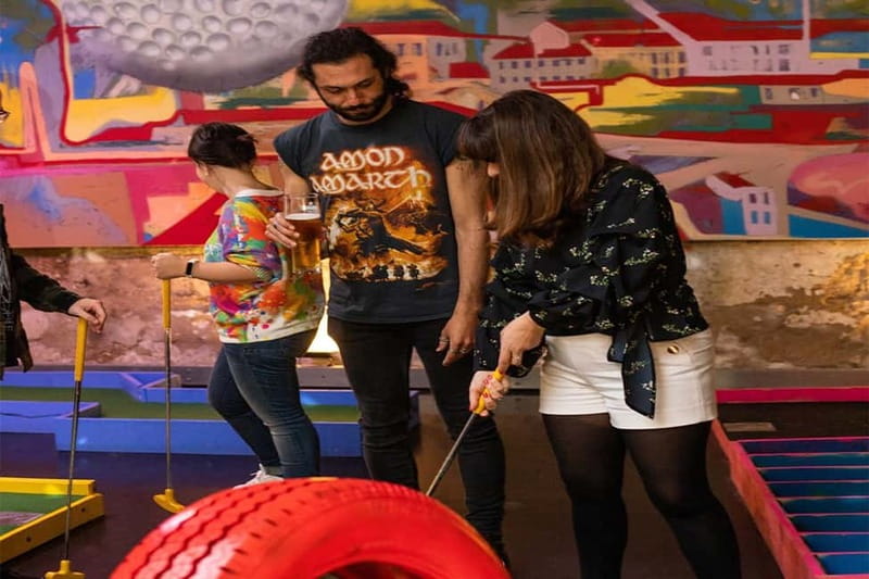 Lisbon: 18-Hole Indoor Minigolf Ticket with Bar Area - Natural light, artwork, and changing visual moods