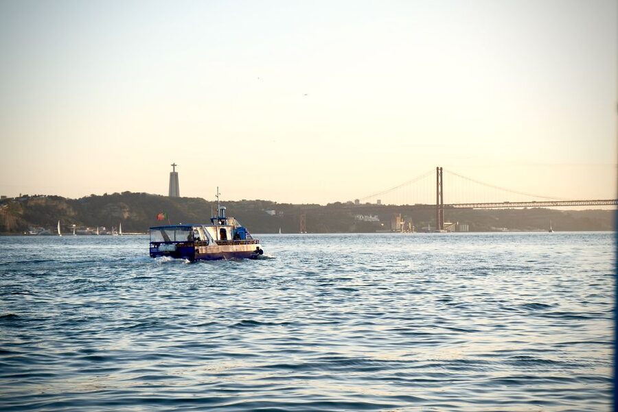 Lisbon: Boat Cruise with Live Fado Performance and a Drink - Passing Commerce Square and the central waterfront