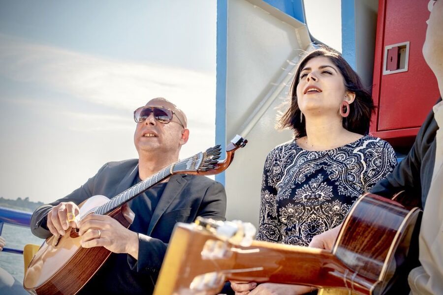 Lisbon: Boat Cruise with Live Fado Performance and a Drink - Passing Alfama from the water