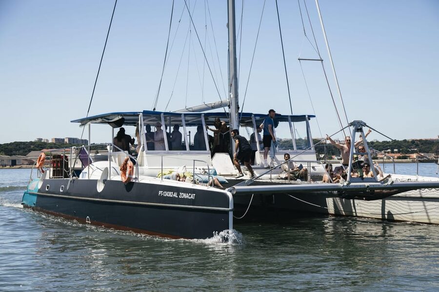 Lisbon: Catamaran Boat Party with Music, Open Bar & Dives - Belem Tower from the water