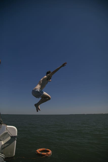 Lisbon: Catamaran Boat Party with Music, Open Bar & Dives - What $57 means for the value