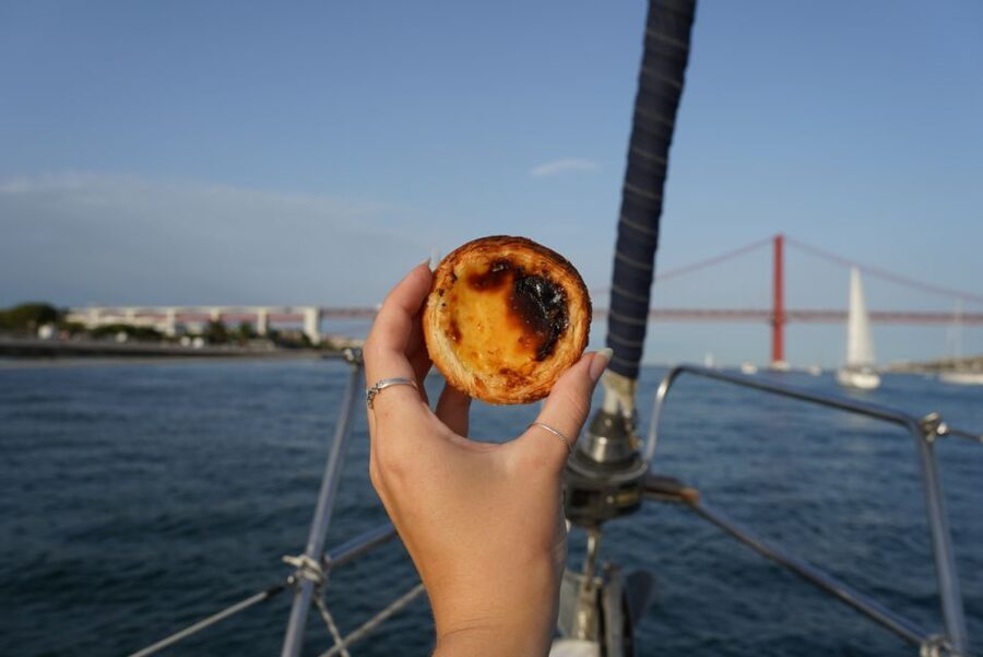 Lisbon: Daytime or Sunset Boat Cruise with History and Wine - Under the 25 de Abril Bridge toward Cristo Rei