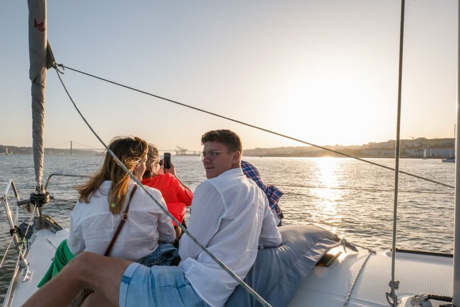 Lisbon: Daytime/Sunset/Night City Sailboat Tour with Drink - Under the 25 de Abril Bridge