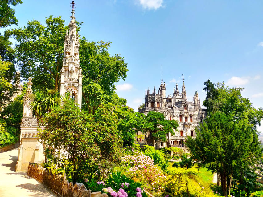 Lisbon: Half-Day Sintra Tour with Pena Palace and Regaleira - Reaching Pena Palace above Sintra