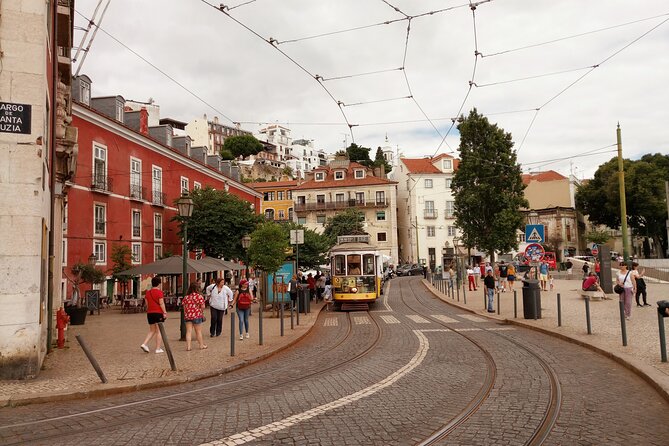 Lisbon Highlights - Private Tour with Van and Local Guide - Walking through Alfama’s old lanes