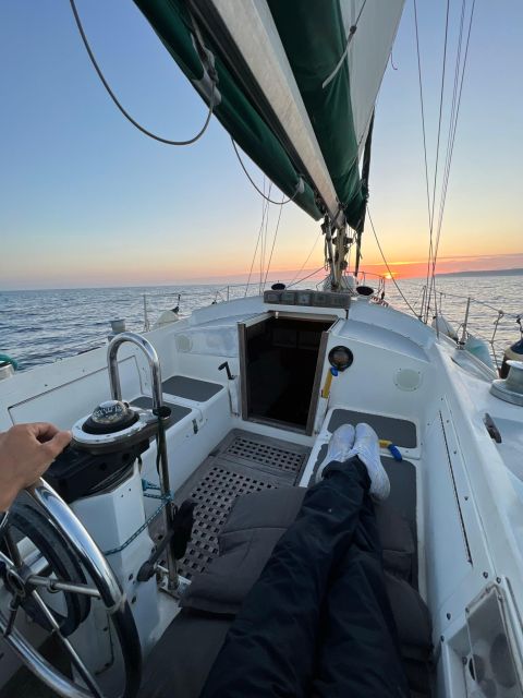 Lisbon: Private Sailing City & Sunset Tour - Sailing beneath the 25 de Abril Bridge