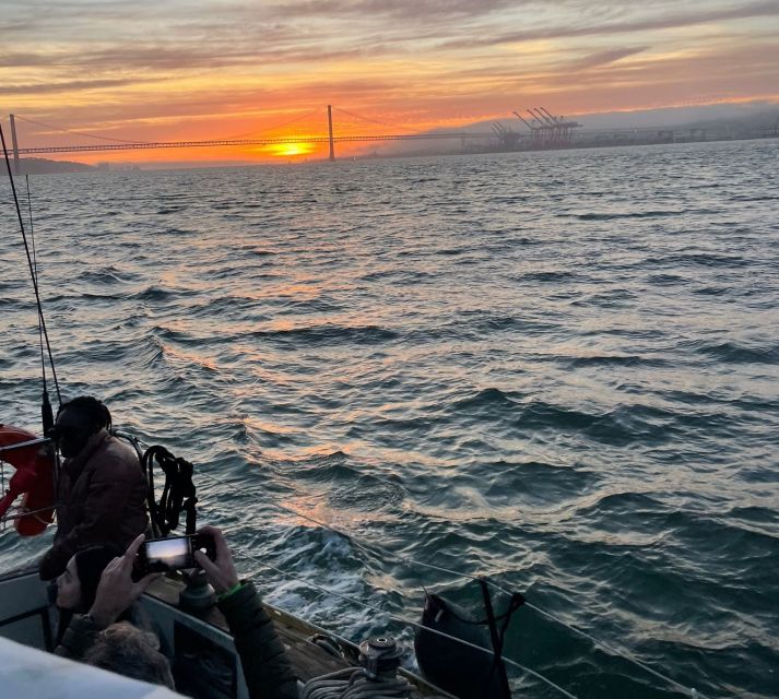 Lisbon: Sailboat Sunset Tour with a Drink - What the guides add to the experience