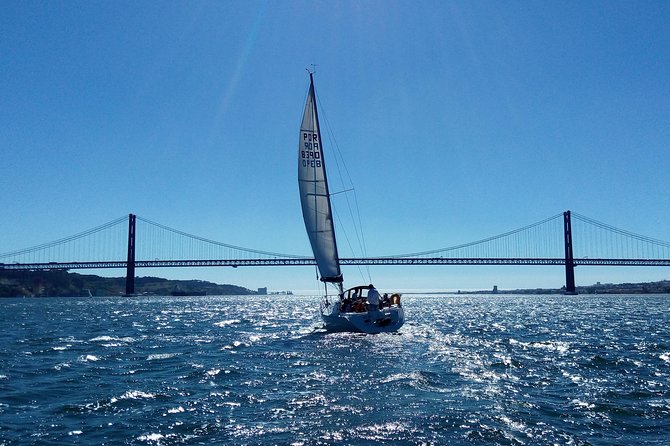 Lisbon Sailing Tour on a Luxury Sailing Yacht with 2 Drinks - Under the 25th of April Bridge