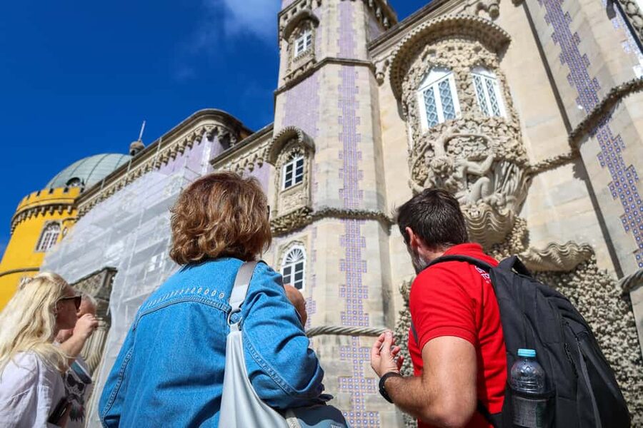 Lisbon: Sintra, Coast and Wine Small-Group Day Tour - Starting in Lisbon and climbing toward Pena Palace