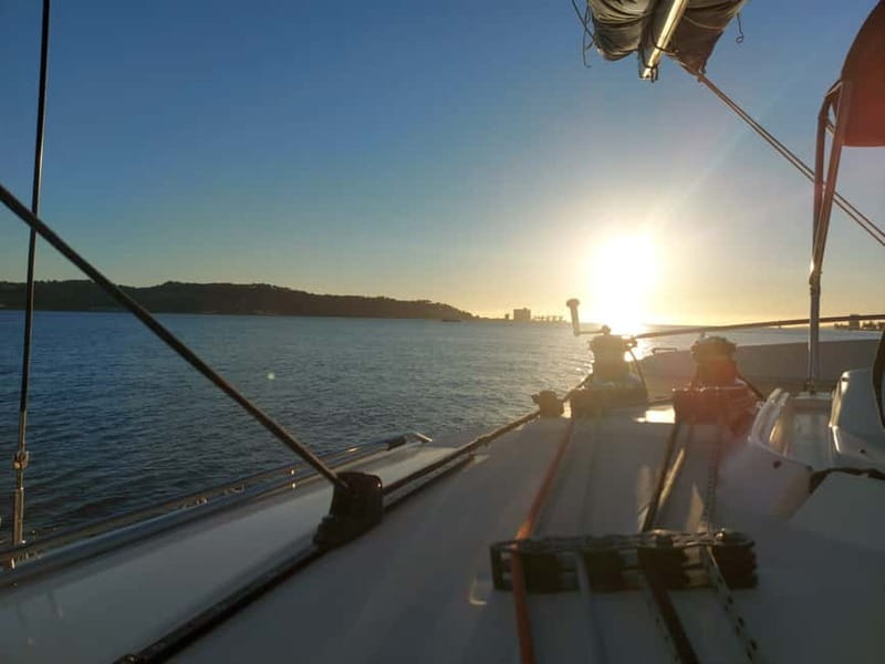 Lisbon: Sunset Catamaran Cruise with Drinks - Passing beneath the 25 de Abril Bridge