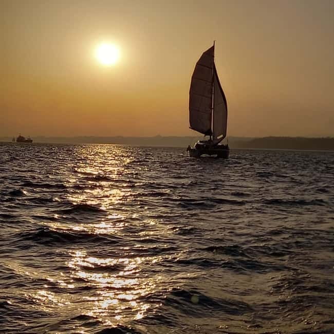 Lisbon: Sunset Catamaran Cruise with Drinks - Belém Tower and the western riverfront
