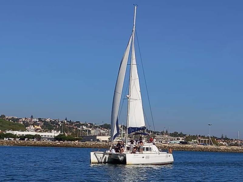 Lisbon: Sunset Catamaran Cruise with Drinks - The boat itself: open decks, nets, and a warm lounge