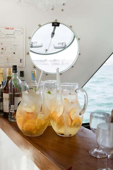 Lisbon: Sunset/Night Boat Party with Open Bar, Snacks & DJ - Drinks, snacks, and what is actually included