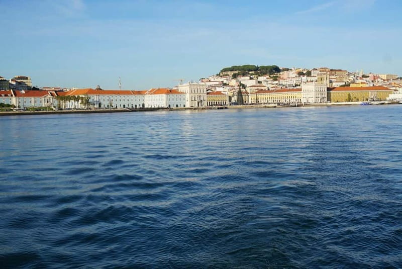 Lisbon: Sunset Sailing Boat Tour with Drinks - Almada and the view back toward Lisbon