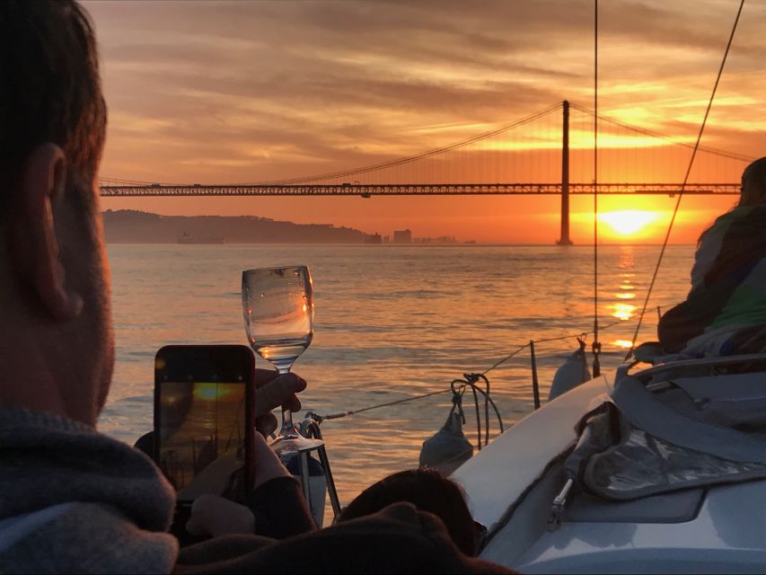 Lisbon: Sunset Sailing Cruise with Wine - Sunset, wind, and changing weather