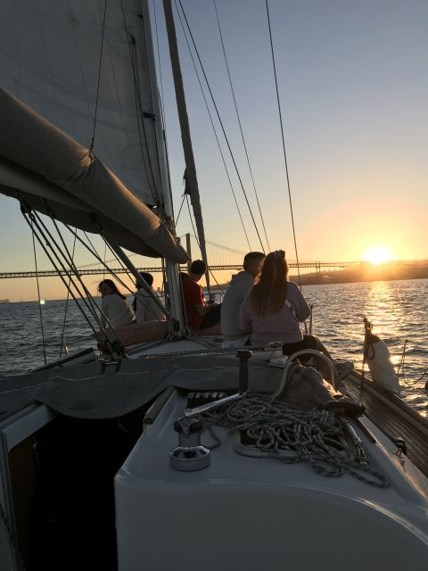 Lisbon Sunset Sailing – Small Group (max 10) Wine & History - Sailing past the bridge and central Lisbon