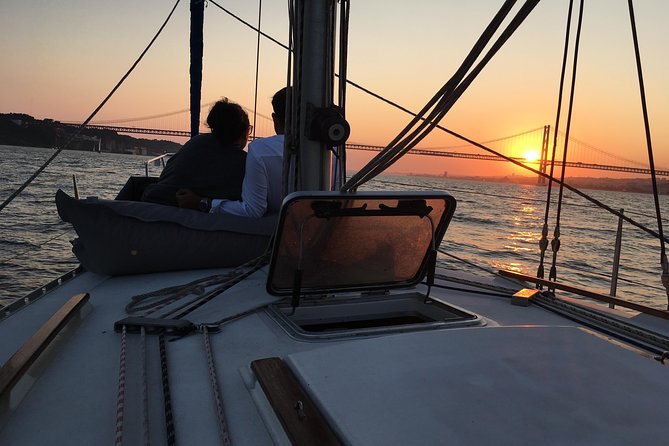 Lisbon Sunset Sailing Tour with White or Rosé Wine and Snacks - Wine, cheese, chouriço, and the onboard mood