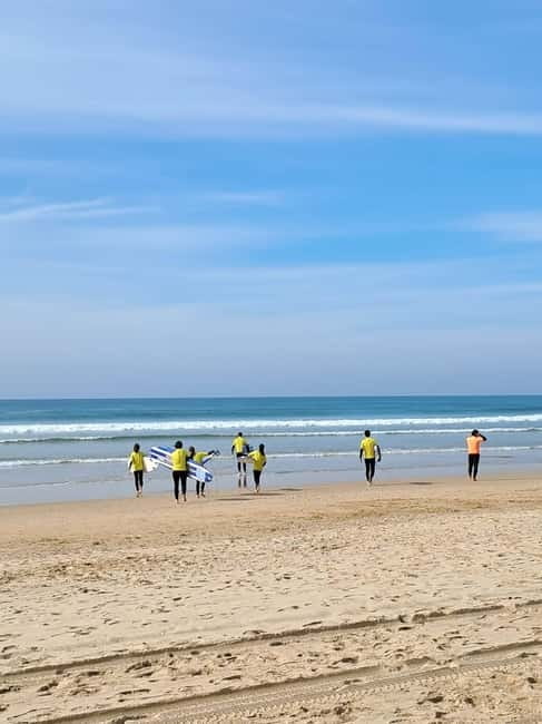 Lisbon: Surfing Lesson on Costa de Caparica Beach - Stretching, a certificate, and pastel de nata