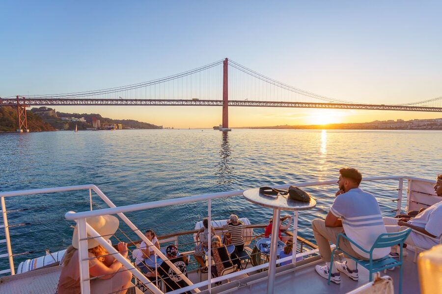 Lisbon: Tagus River Sunset Tour with Snacks and Drink - Belém Tower at golden hour