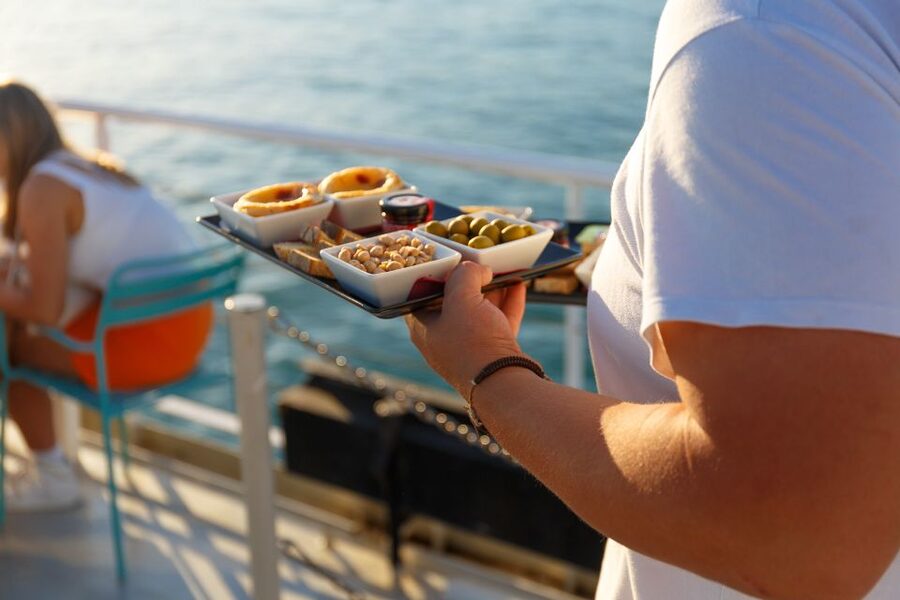 Lisbon: Tagus River Sunset Tour with Snacks and Drink - Alfama from the Tagus