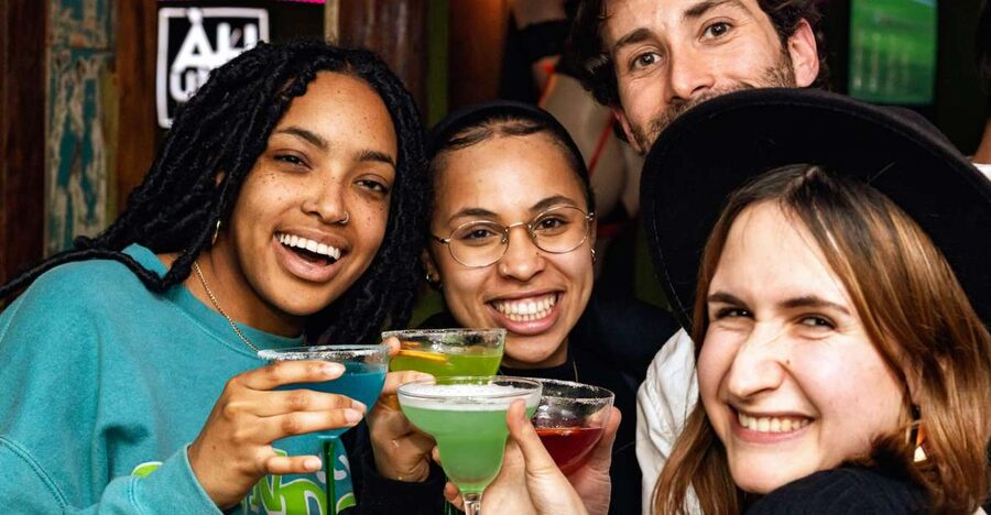 Lisbon: Tipsy Tour Fun Bar Crawl with a Local Guide - Walking into Bairro Alto after dark