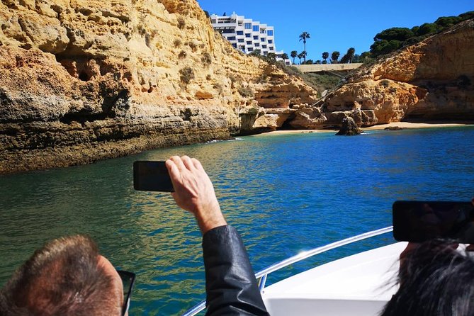 Lisbon to Algarve Private Tour: Benagil Caves Cruise & Top Sights - Entering Benagil Cave by small boat