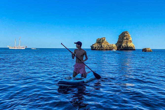 Paddleboard rental in Lagos - Paddling toward caves and rock formations