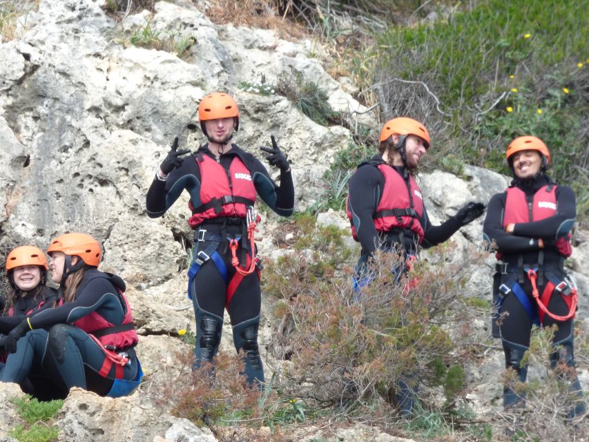 Portinho da Arrábida: Coasteering Boat Tour - Suited up for cold Atlantic water
