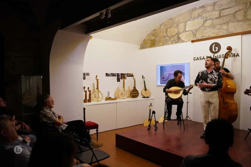 Porto: Authentic Fado Show, Port Wine & Handmade Instruments - Entering Casa da Guitarra near the Dom Luís Bridge