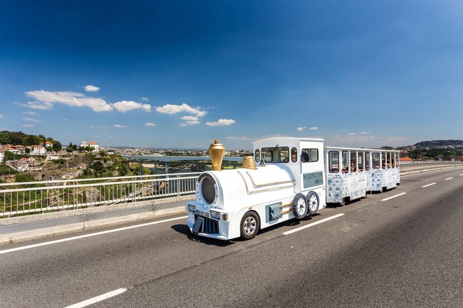 Porto: City Train Tour, River Cruise & Wine Cellar - Riding through Porto’s historic center
