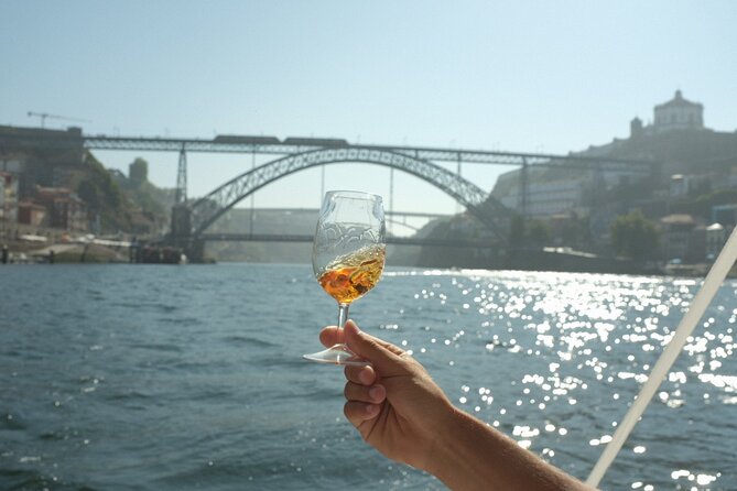 Porto: Douro River Boat Cruise with Port Wine and Snacks - Porto’s oldest bridge and the engineering story above you