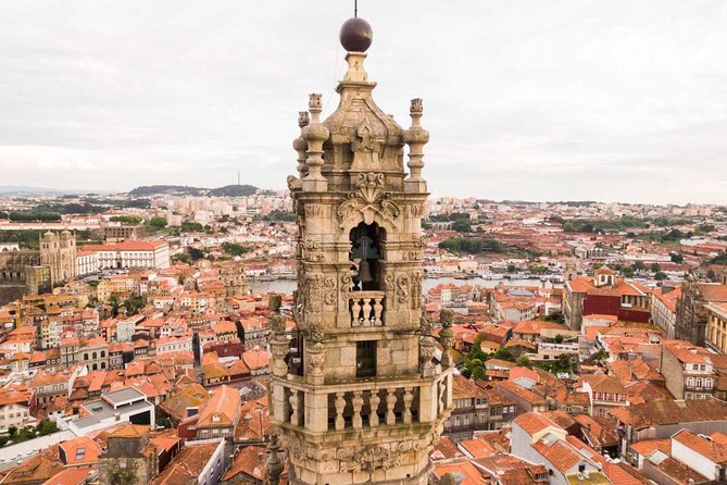Porto Full Day City Tour Wine Tasting and Six Bridges Cruise - Porto’s old streets and the Clérigos exterior