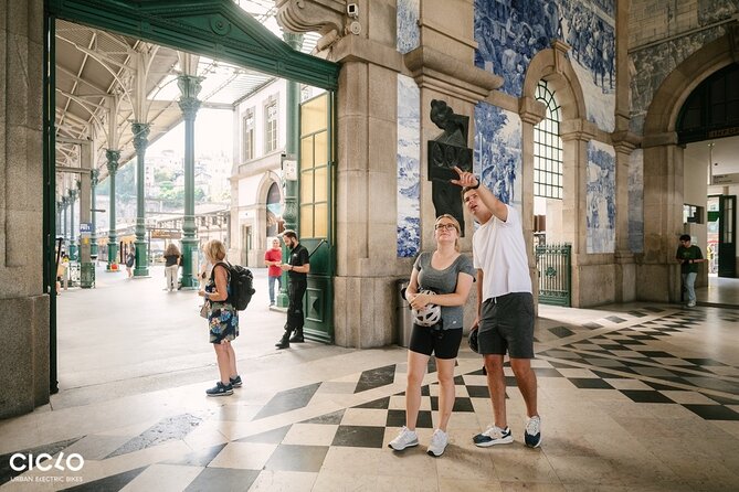 Porto Highlights in 3 Hours E-Bike Tour - Historical, Sightseeing - Avenida dos Aliados shows modern Porto at work
