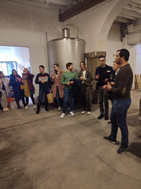 Porto: Port and Douro Wine Walking Tour with 9 Tastings - Starting beside the riverfront tourist office