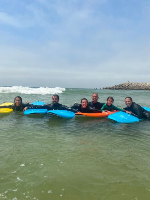 Porto: Small Group Surfing Experience with Transportation - Getting fitted for the board and wetsuit
